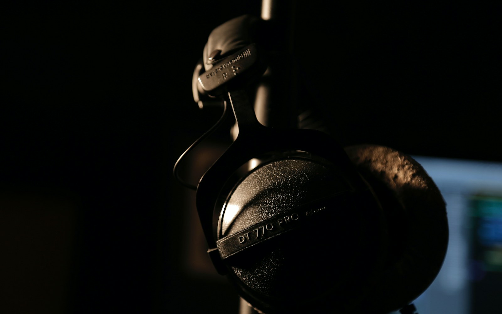 Headphones in a dark home recording studio
