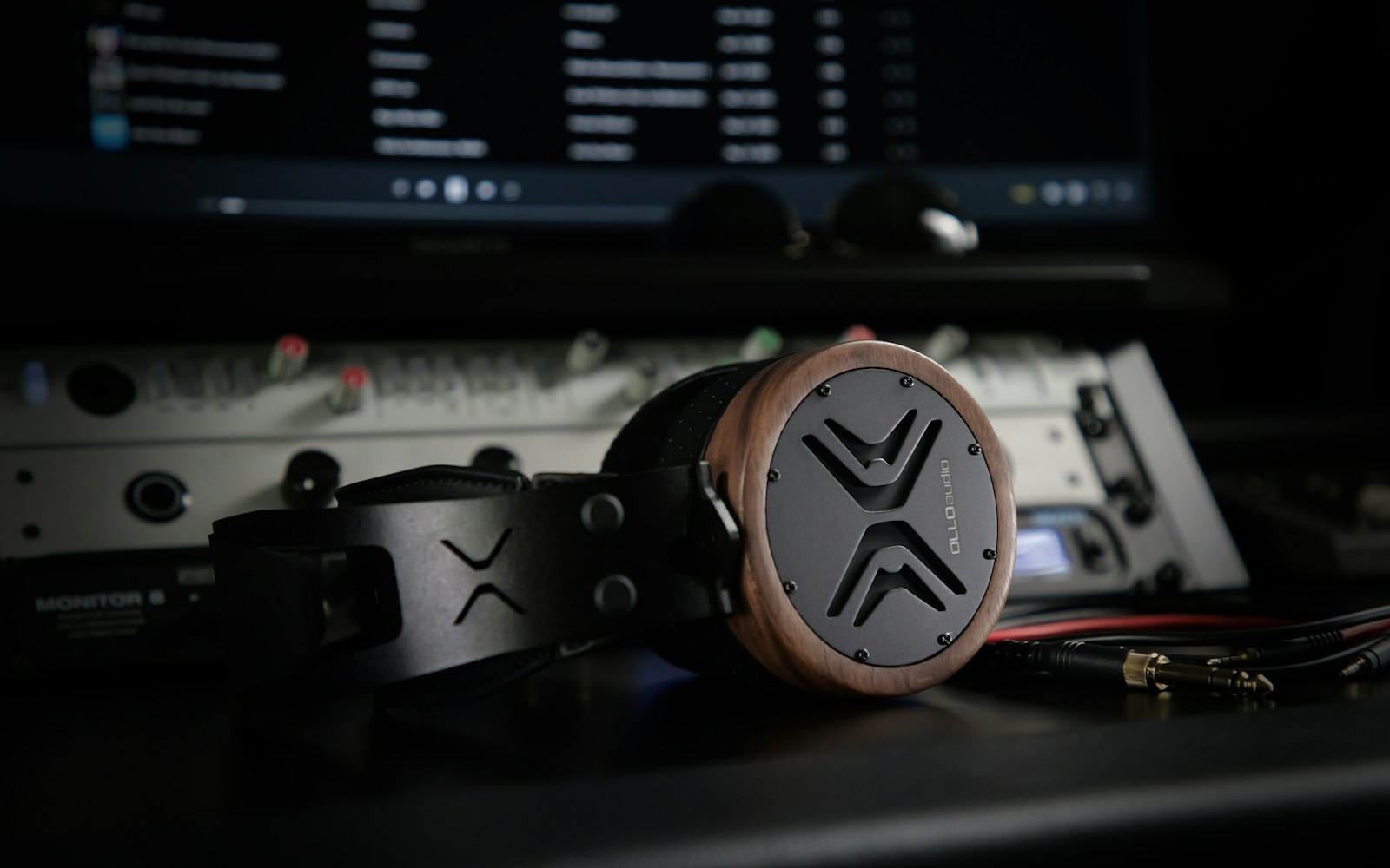 Studio headphones in front of an audio workstation