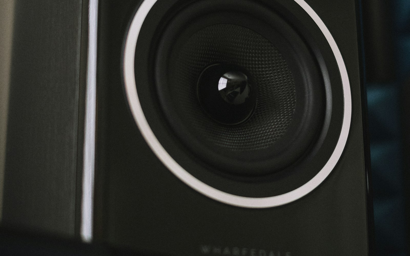 Audio speaker illuminated by blue light